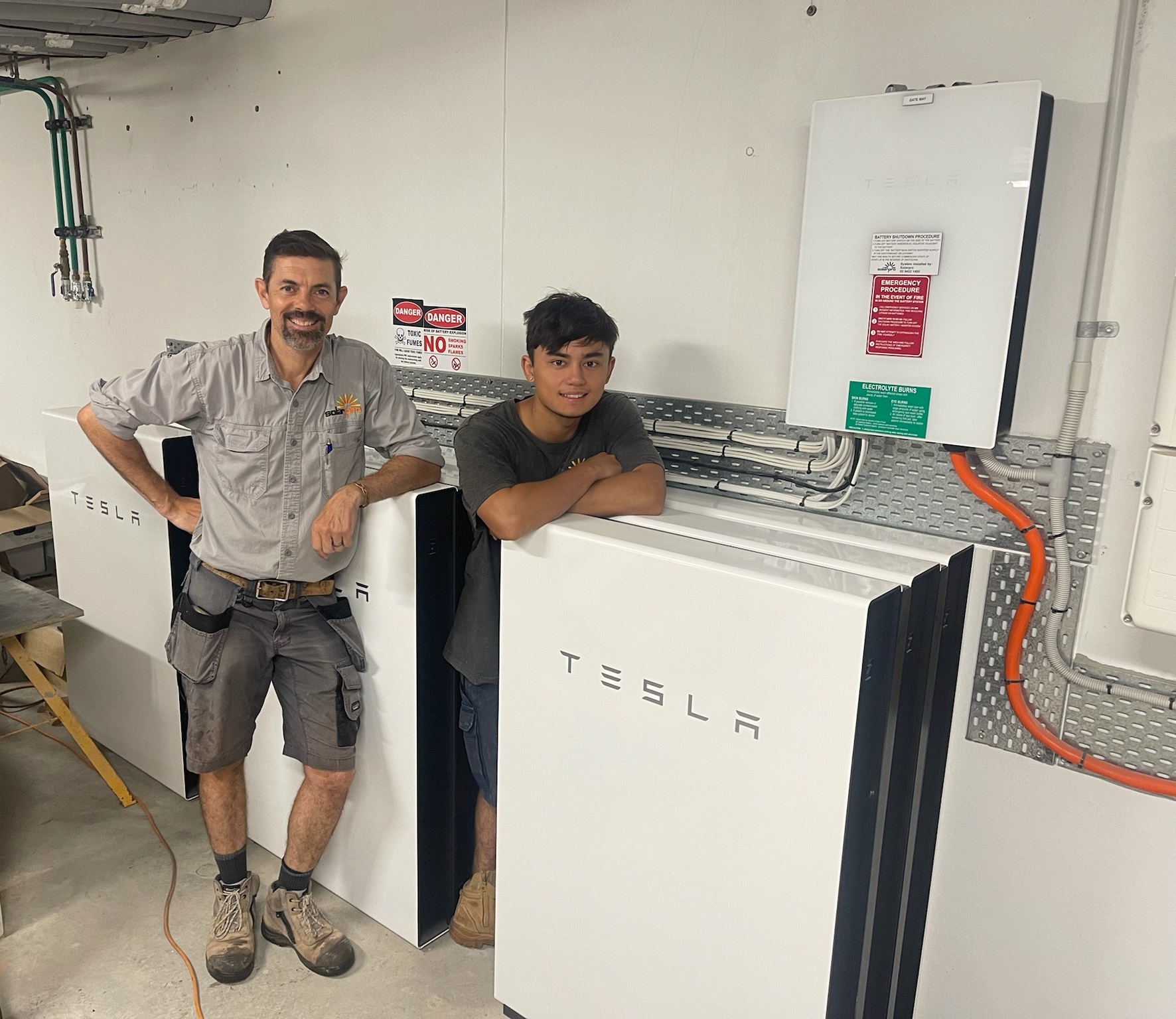 Installers take a break during a Tesla Battery installation